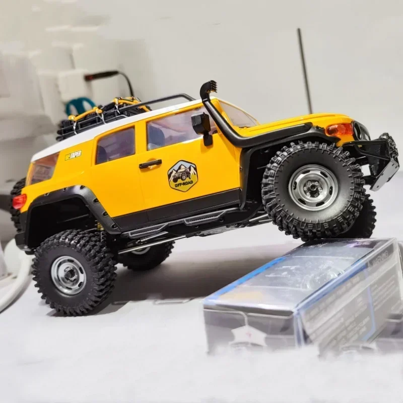 Nowy Model samochodu Fms 1:18fj Cruiser Model Rc zdalnie sterowanym samochodowym wspinaczki symulacyjnej elektryczny samochodzik zabawkowy prezenty dla chłopców