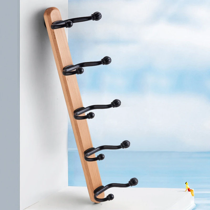 Wall mounted clothes hook, wall mounted black clothes hook, Nordic beech wood base, suitable for bathrooms, cloakrooms, and more