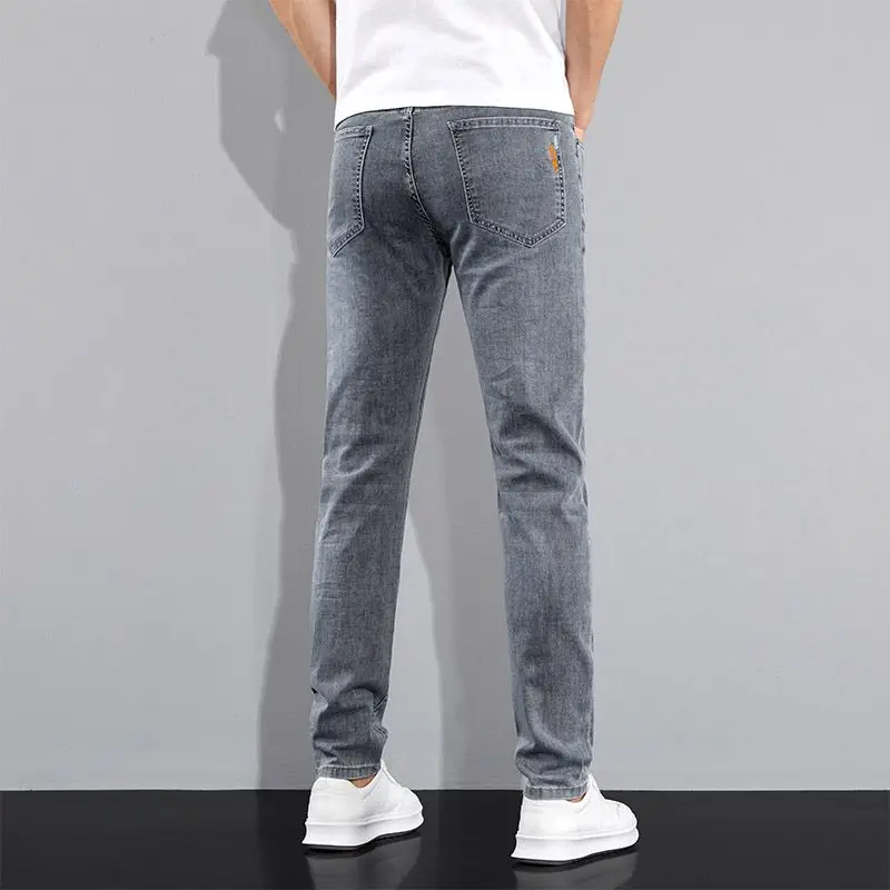 アメリカの男性のハイストリートダメージ加工ストレッチスキニージーンズパンツ秋冬ヴィンテージロングジーンズ因果多用途男性ズボン