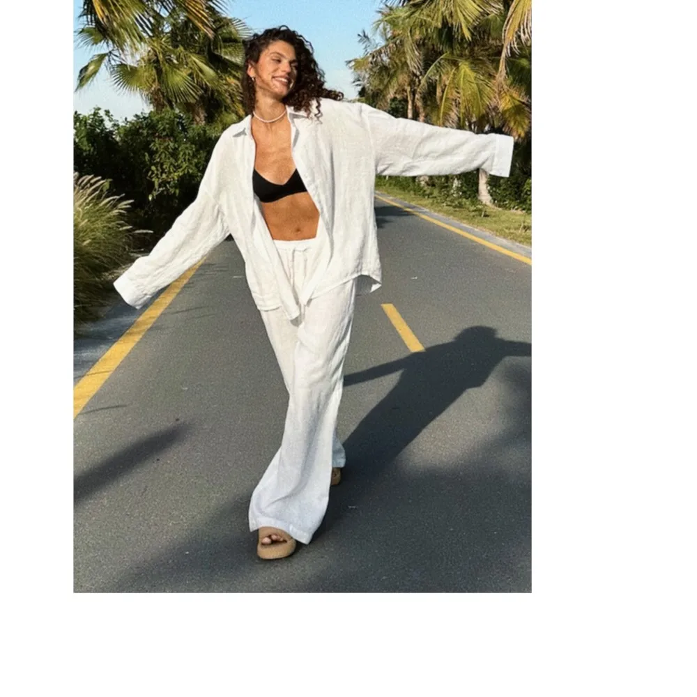 

Повседневный пляжный однобортный женский топ с лацканами и длинными рукавами, комплект из двух предметов, весна-лето, новый модный комплект с длинными брюками на шнуровке2025