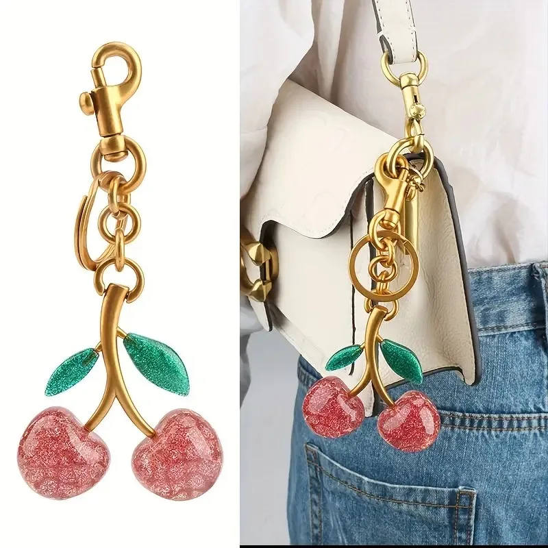 

Polyresin Cute Cherry Pendant Charms for Purse and Keychain Sparkling Resin Cherry Bag Accessories with Gilded Metallic Clasp