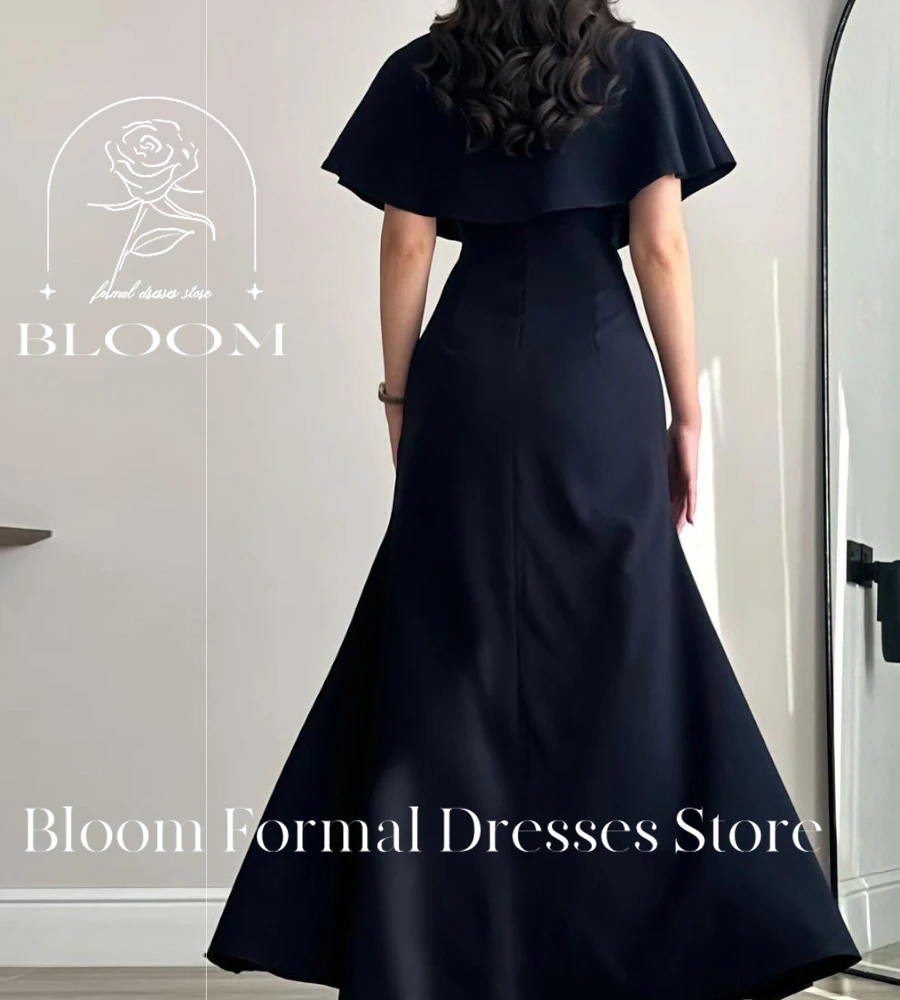 Bloom Customized Sophisticated Navy Blue Dress features a unique cape detail with decorative blue flowers. The straight neckline