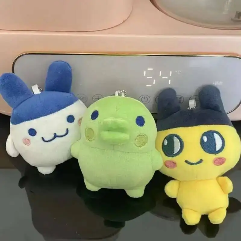 Lindo Tamagotchii colgante de felpa lindo relleno Mimiji Tama familia mochila colgante tarjeta bolsa colección juguete para chico regalos de cumpleaños