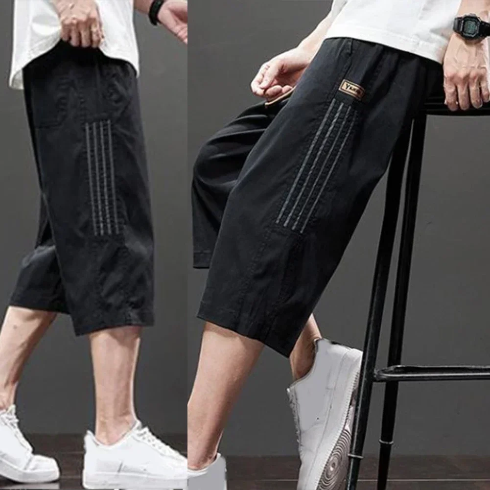 

Повседневные мужские летние шорты свободного покроя, праздничные черные повседневные шорты, обычная длина одежды, сплошной цвет, подходит для лета