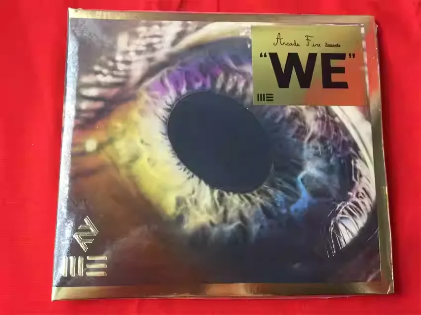 

Arcade Fire We CD: Special Edition with 14 Polaroid Inserts, Produced By Nigel Godrich Sixth Studio Album Released May 6, 2022