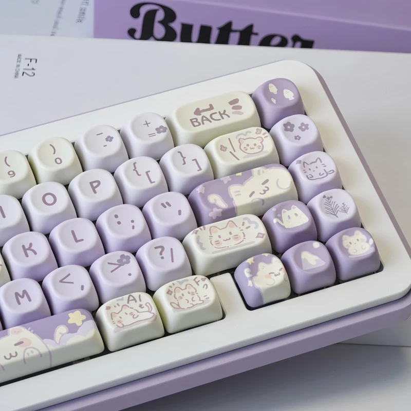 

Adorable little cat-shaped keycaps with taro paste design, MOA height, highly customizable mechanical keyboard keycaps.