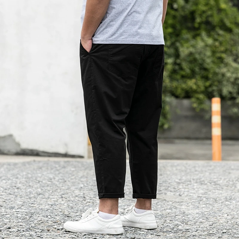 Autumn new men's plus size stretch casual pants 9XL 8XL 7XL fashion men's zipper pocket loose solid color pants.