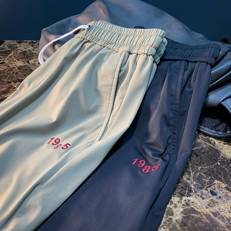 

Summer ice silk casual pants for men, trendy embroidery drawstring sports and casual versatile quick drying pants