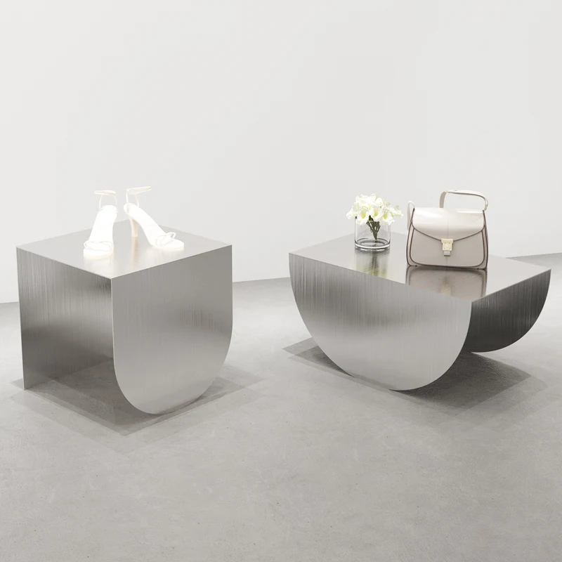 

Clothing store window display props Stainless steel product placement display table High and low running water table Shoes