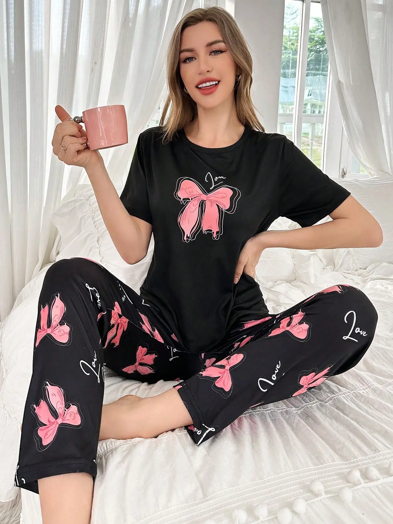 

Black Pajama Set with Pink Bow Print, Short Sleeve Top & Capri Pants