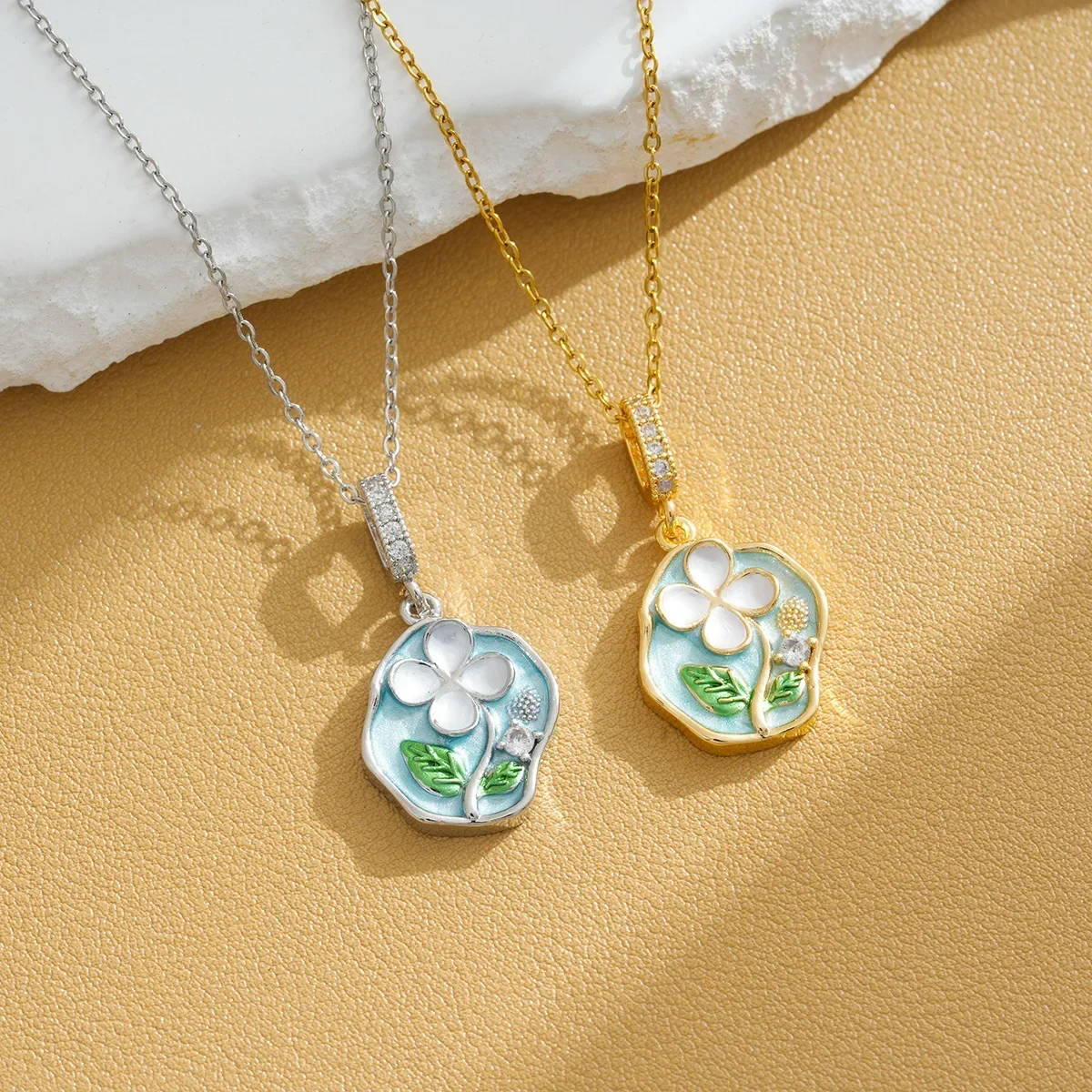

The oil painting style necklace doesn't fade. It's a fresh and elegant girl with real gold electroplating