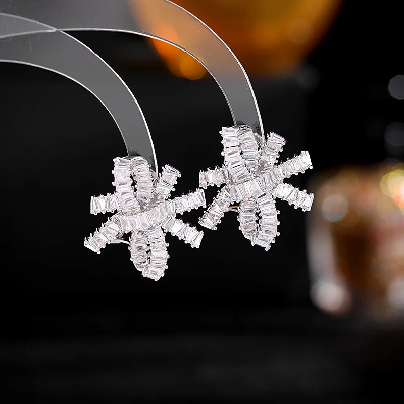 

Sparkling Baguette Shaped CZ Loop Ribbon Bowtie Stud Earrings for Cocktail Party