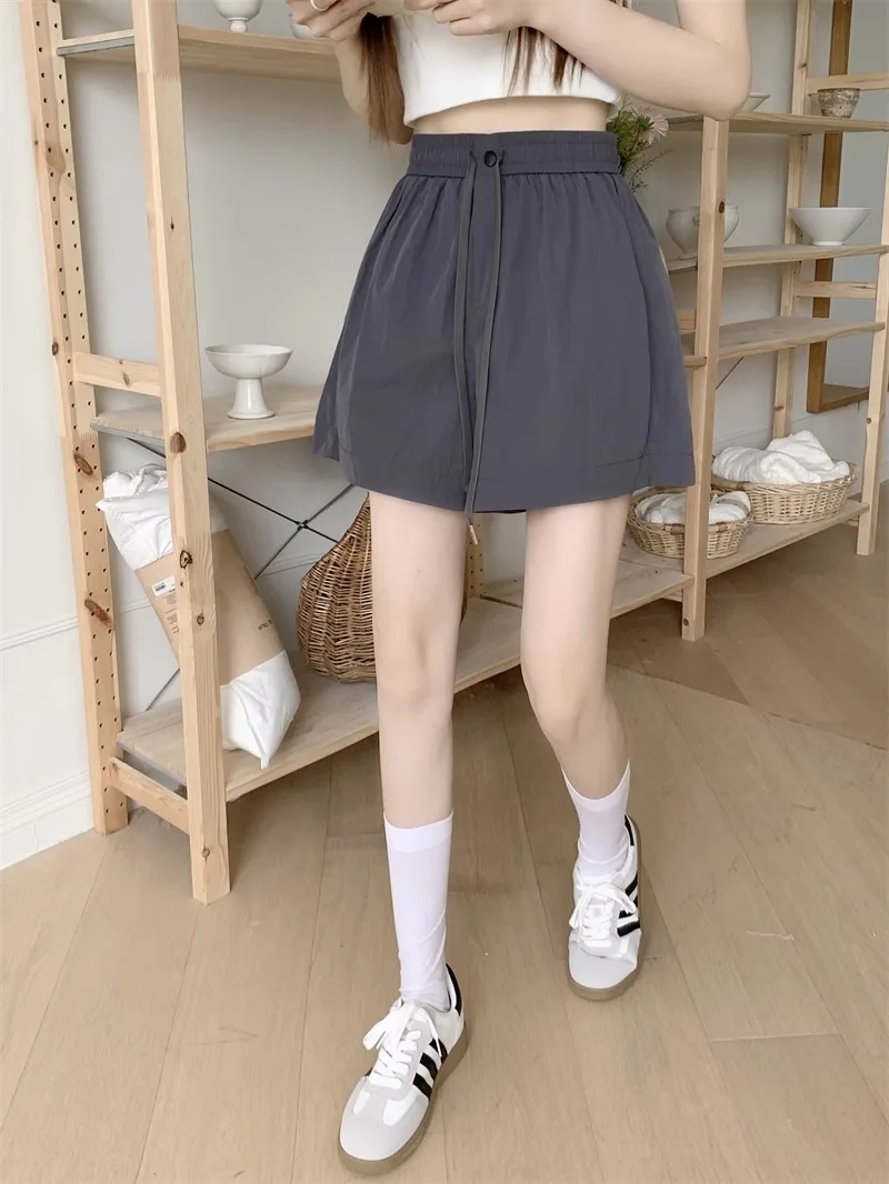 Pantalones cortos para mujer Y2K Denim Harajuku Vintage tiro bajo caliente Mini cadera envuelto ropa de calle azul moda botín pantalones de verano europeos