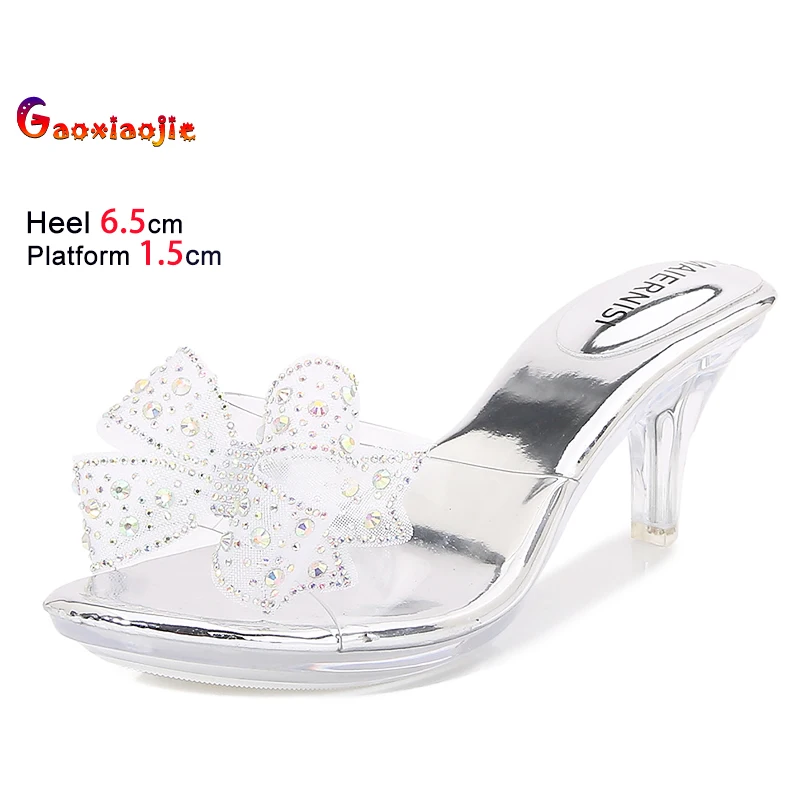 

Новые женские тапочки на прозрачном тонком каблуке с бантом из страз, летние туфли без застежки, высокий каблук 6,5 см, прозрачные повседневные женские сандалии из ПВХ