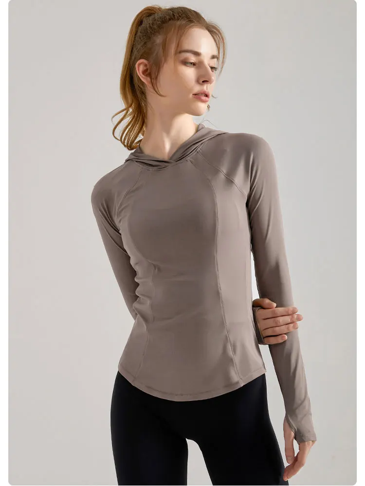 Felpe sportive da donna autunno inverno camicia da Yoga sottile in rilievo maglietta da corsa con foro per il pollice a maniche lunghe allenamento in palestra Top con cappuccio Fitness