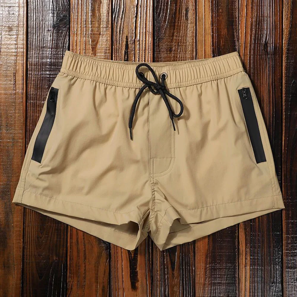 

Новые летние мужские однотонные спортивные шорты, повседневные модные трендовые свободные простые дышащие быстросохнущие пляжные мужские шорты для спортзала