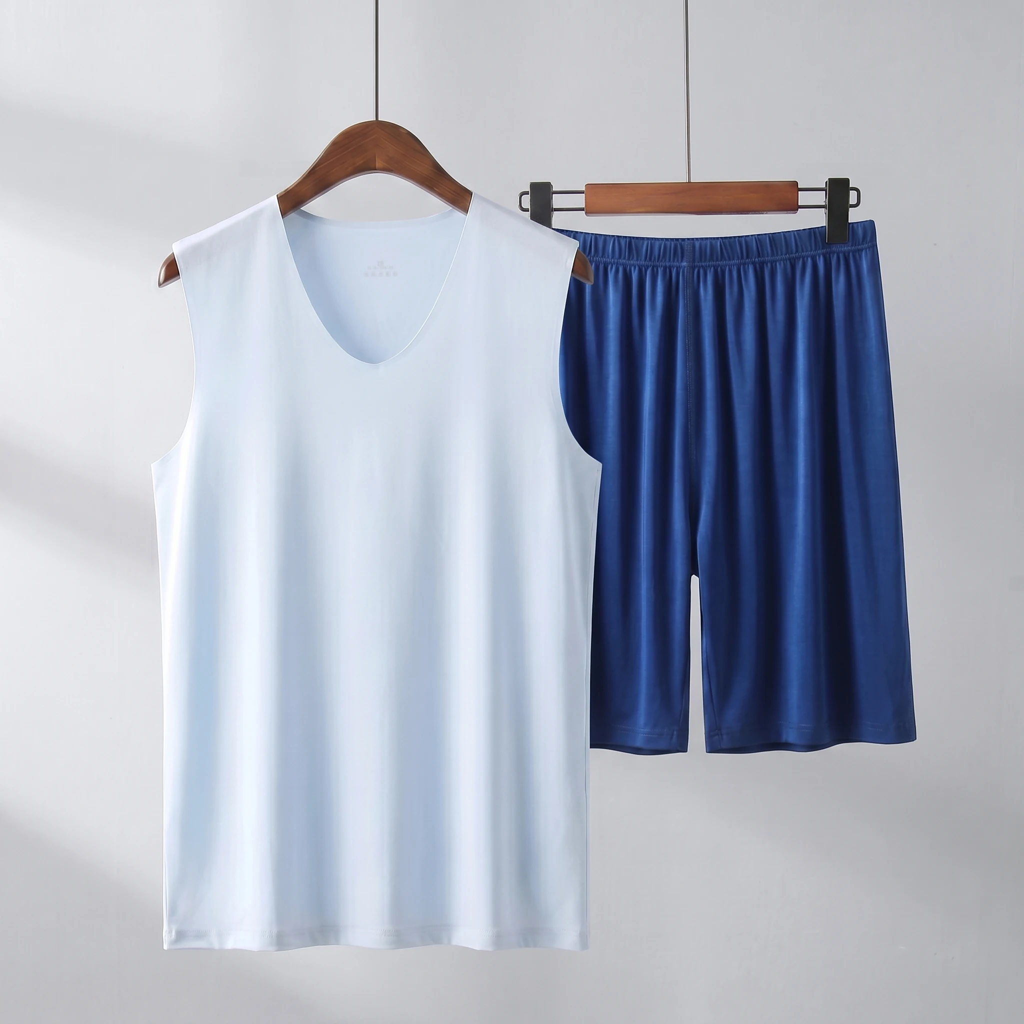 Light blue vest + dark blue shorts