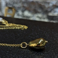 Golden color bean shape chain necklace