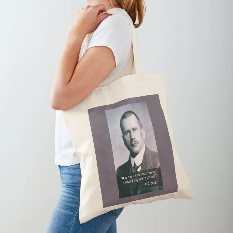 

Carl Jung portrait and quote: It is not I who create myself, rather I happen to myself. Tote Bag