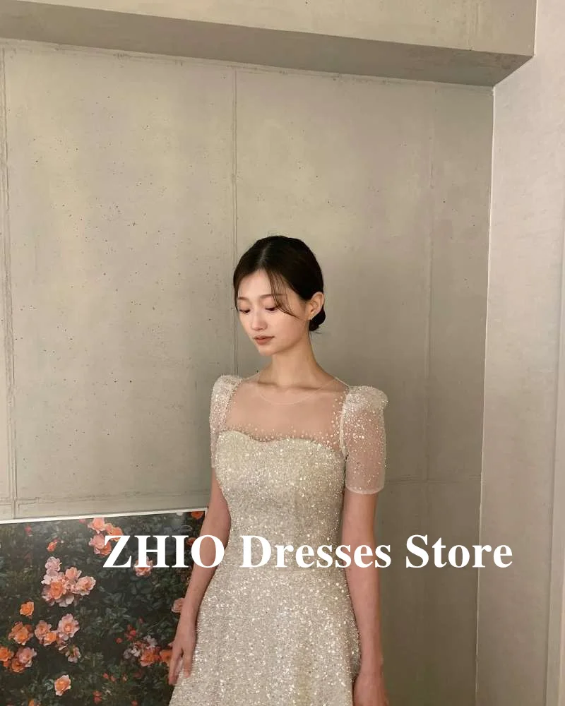 ZHIO فساتين زفاف لامعة لامعة كوريا صورة تبادل لاطلاق النار قصيرة الأكمام ساحة الرقبة تول فساتين العروس مساء لامعة حسب الطلب