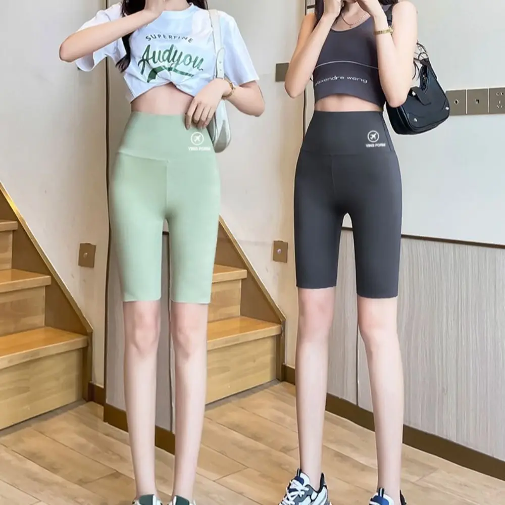 Pantaloncini da yoga attillati per il sollevamento dell'anca streetwear Pantaloncini da motociclista traspiranti per il controllo della pancia dei glutei elastici color pesca Leggings da donna