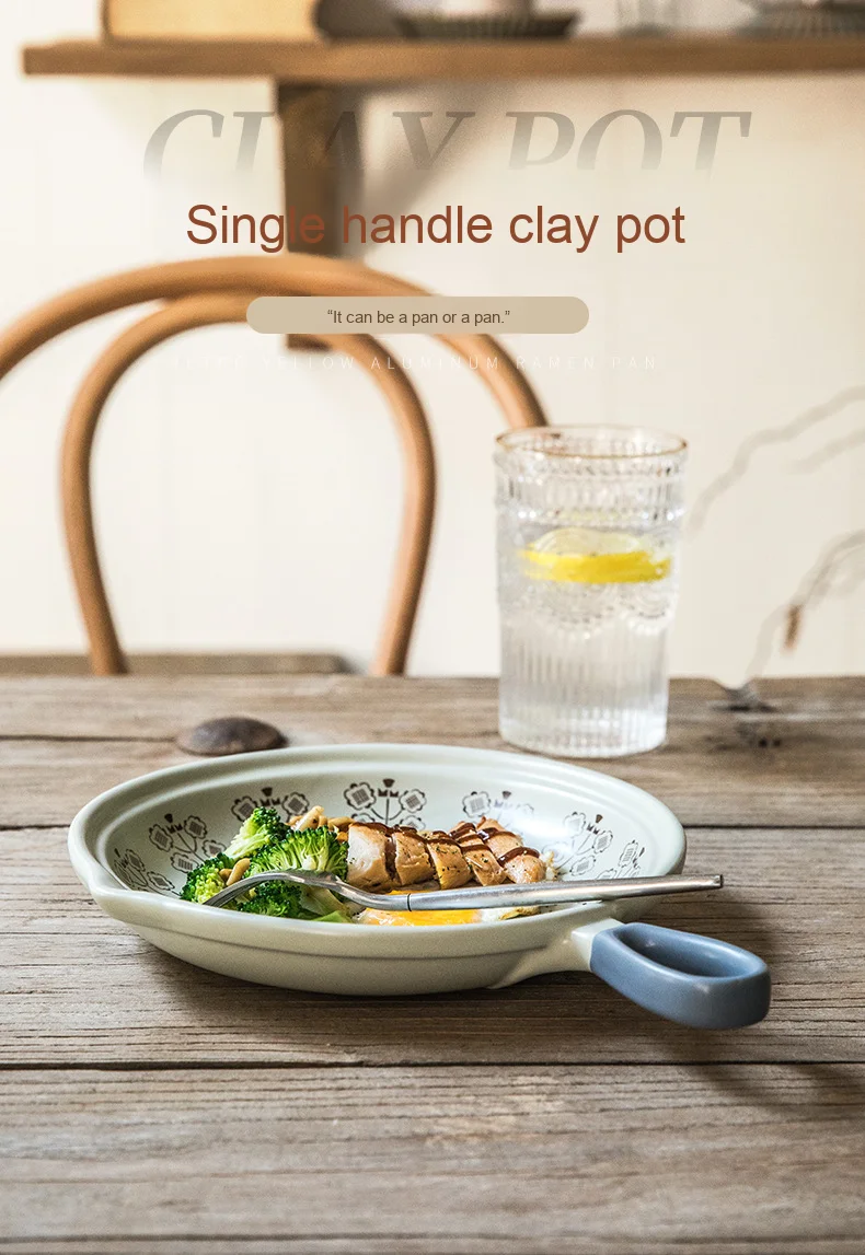 Minimally Designed Ceramic Flat Bottomed Clay Pot That Can Be Used with an Open Flame and a Frying Pan with a Handle