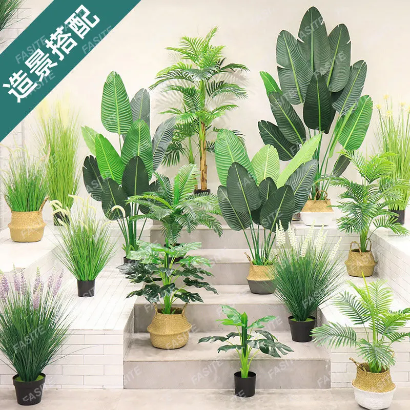 Artificial landscape decoration of green plants, dog tail grass, reeds, traveler plantain plants