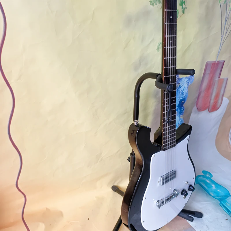 Black Irregular Solid Body Electric Guitar, Dual Humbuckers, Yellow Pickguard, 6-String Electric Guitar. Vintage & Unique Styling, Perfect for Beginner Practice and Rock Stage Performance.