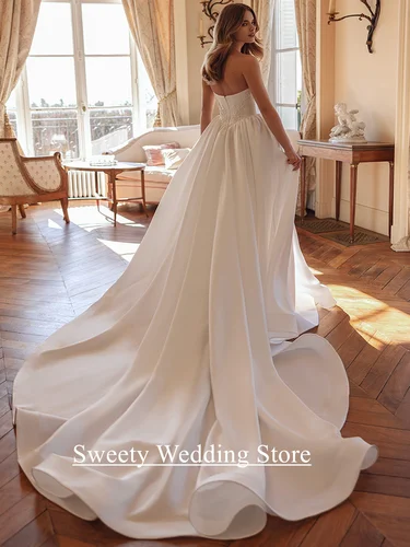 Imagen 2 del producto Encantador vestido de novia vestido de novia personalizado sin tirantes sin mangas apliques de cuentas una línea capilla tren vestidos de novia de satén