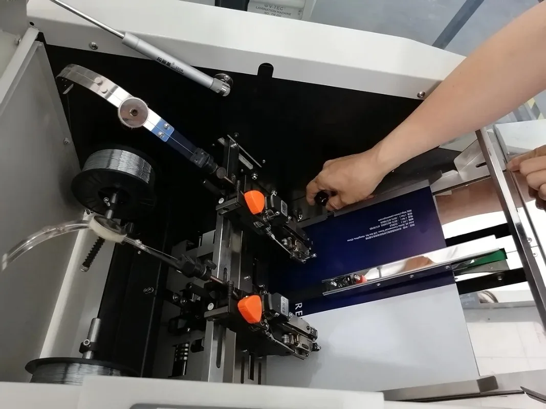Hot items in the store Automatic Paper Folding and Stapling in One Pass Booklet Maker Machine with Hohner Head