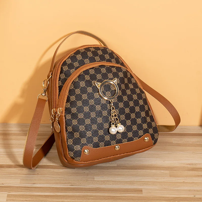 New trend and fashion printed backpack, cat pendant, niche design, portable shoulder bag backpack women  bags