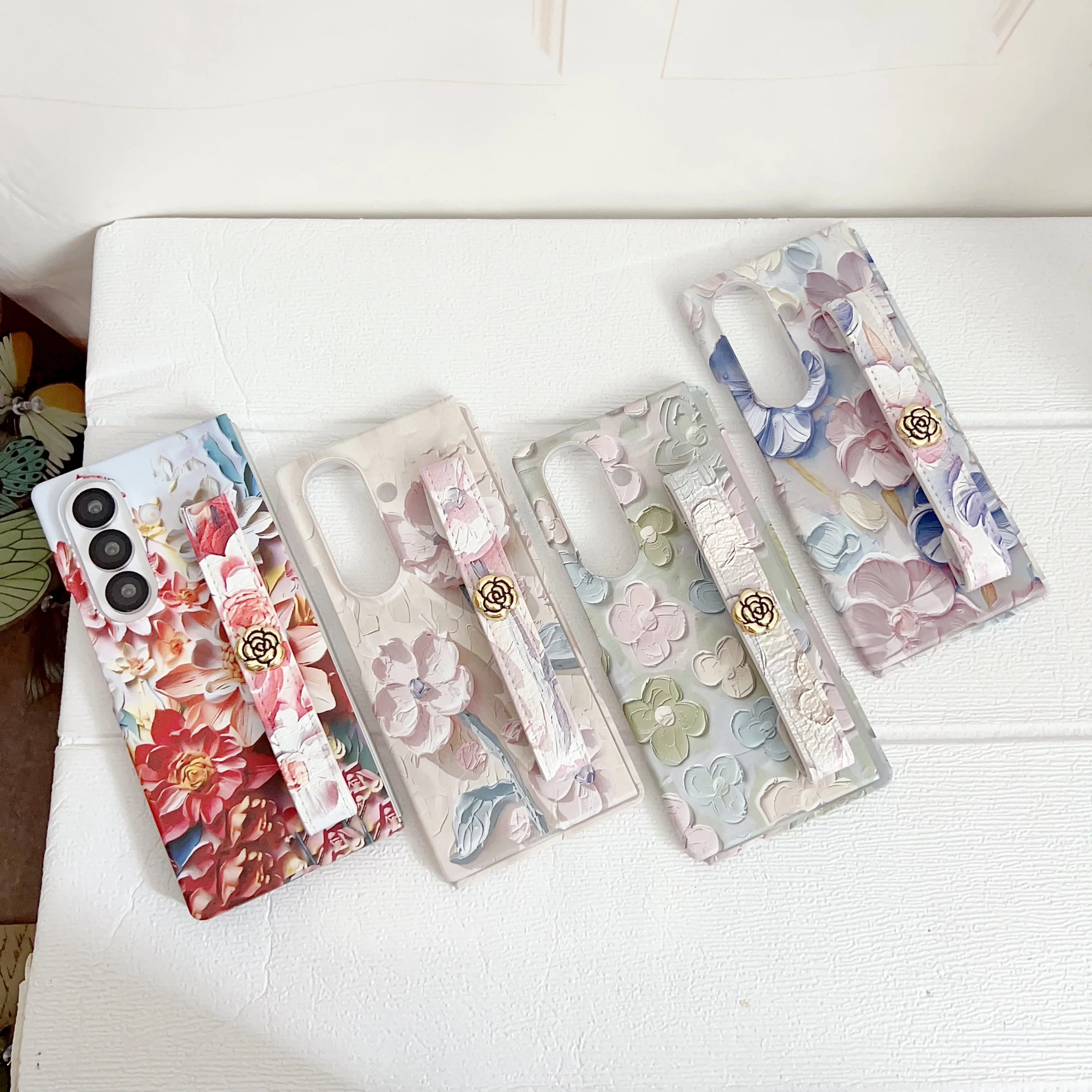 

Embossed Watercolor Camellia Wrist strap Foldable Screen Phone Case For Samsung Galaxy Z Flod 7/6/5/4 Full Coverage Protection