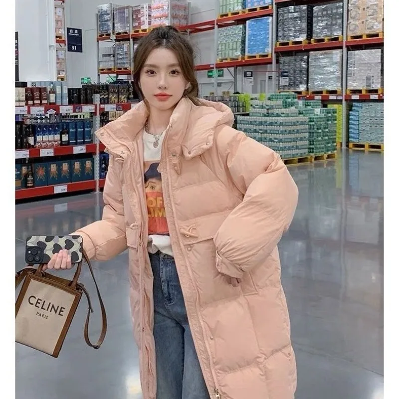 Chaqueta gruesa de cuerno de vaca rosa para mujer, versión coreana de invierno fuera de temporada, chaqueta de longitud media, nuevo pan de plumón de pato