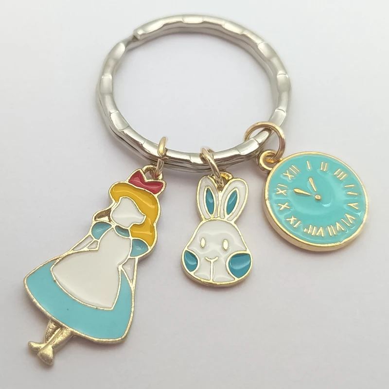 1 piece of high-quality fashion jewelry Alice in Wonderland keychain, coffee cup watch rabbit spoon keychain, clock keychain