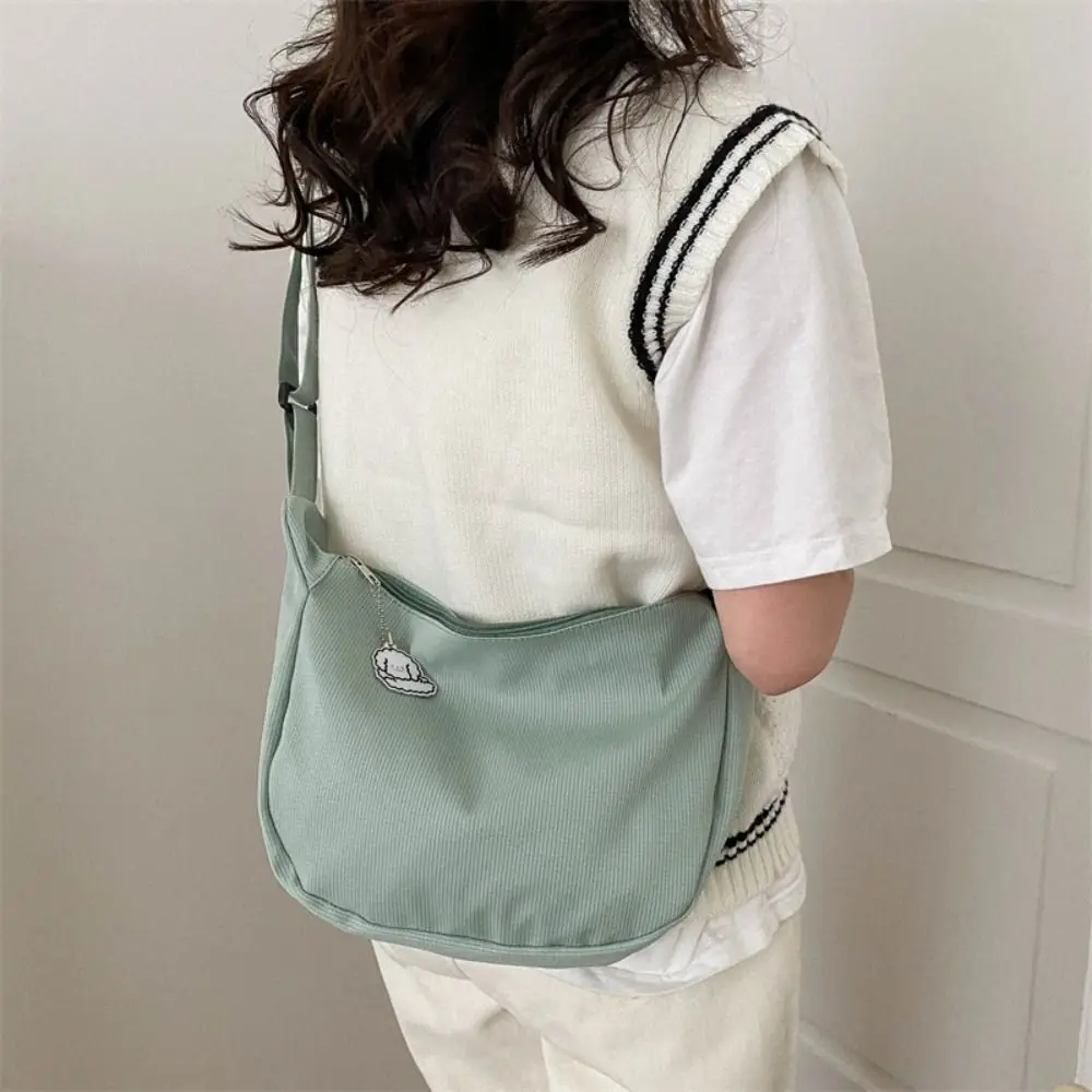 Large Capacity Lightweight Shoulder Bag Solid Color Cream Color Canvas Bag with Pendant Messenger Bag Handbag