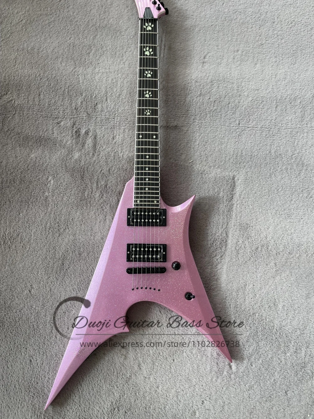 7 string pink guitar, shiny powder body, fixed bridge, luminous cat-claw inlay fingerboard, HH pickups, stainless steel frets