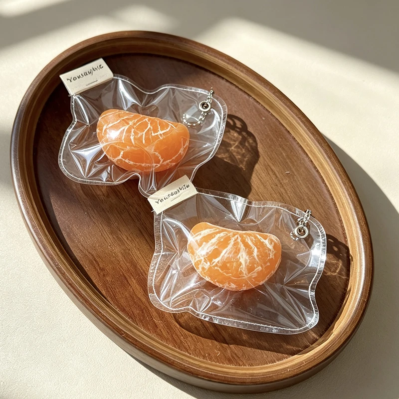 Handmade realistic tangerine segment squeeze toy—convenient to carry around for stress relief.
