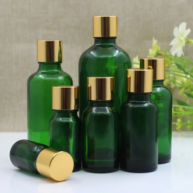 24 pezzi 5 ml 10 ml 15 ml 20 ml 30 ml 50 ml 100 ml Bottiglia di olio essenziale di vetro verde Bottiglia vuota per imballaggio cosmetico Cura personale con coperchio