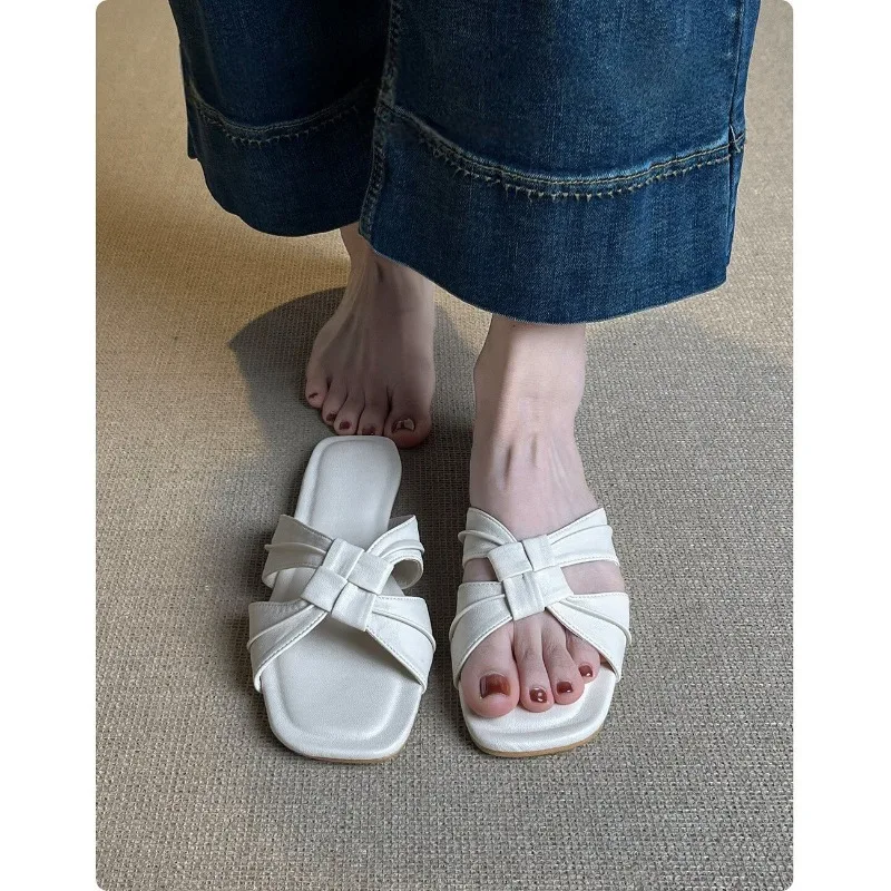 

2026 summer new French square head woven sandals, versatile flat bottom one-word drag women wear beach shoes