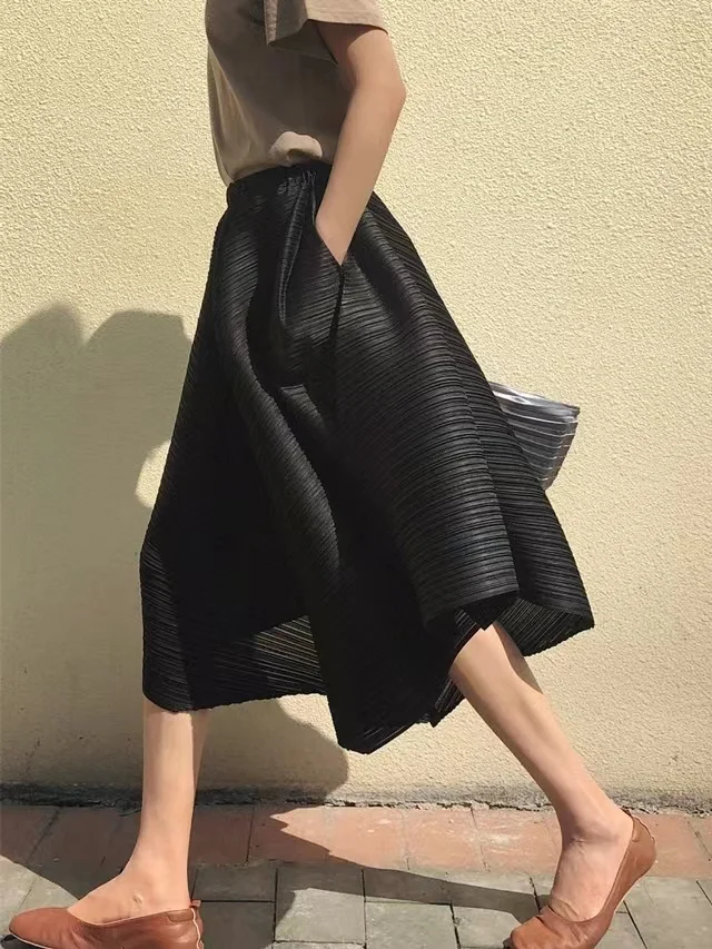 

Pleated skirt pants with irregular hem and umbrella shaped loose wide leg pants