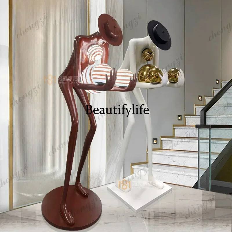 Modern abstract bending over and holding the ball, figure statue, floor lamp villa hotel living room, fiberglass ornament