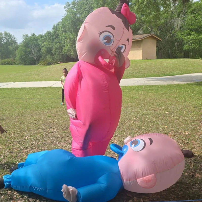 An Adult-Sized Inflatable Baby, In Blue Or Pink — photograph 3