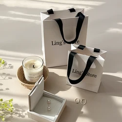 Sac fourre-tout en papier avec logo personnalisé, poignée de bijoux blanche et noire, boîte d'emballage cadeau bricolage, poudres de voyage personnalisées, faveurs de mariage