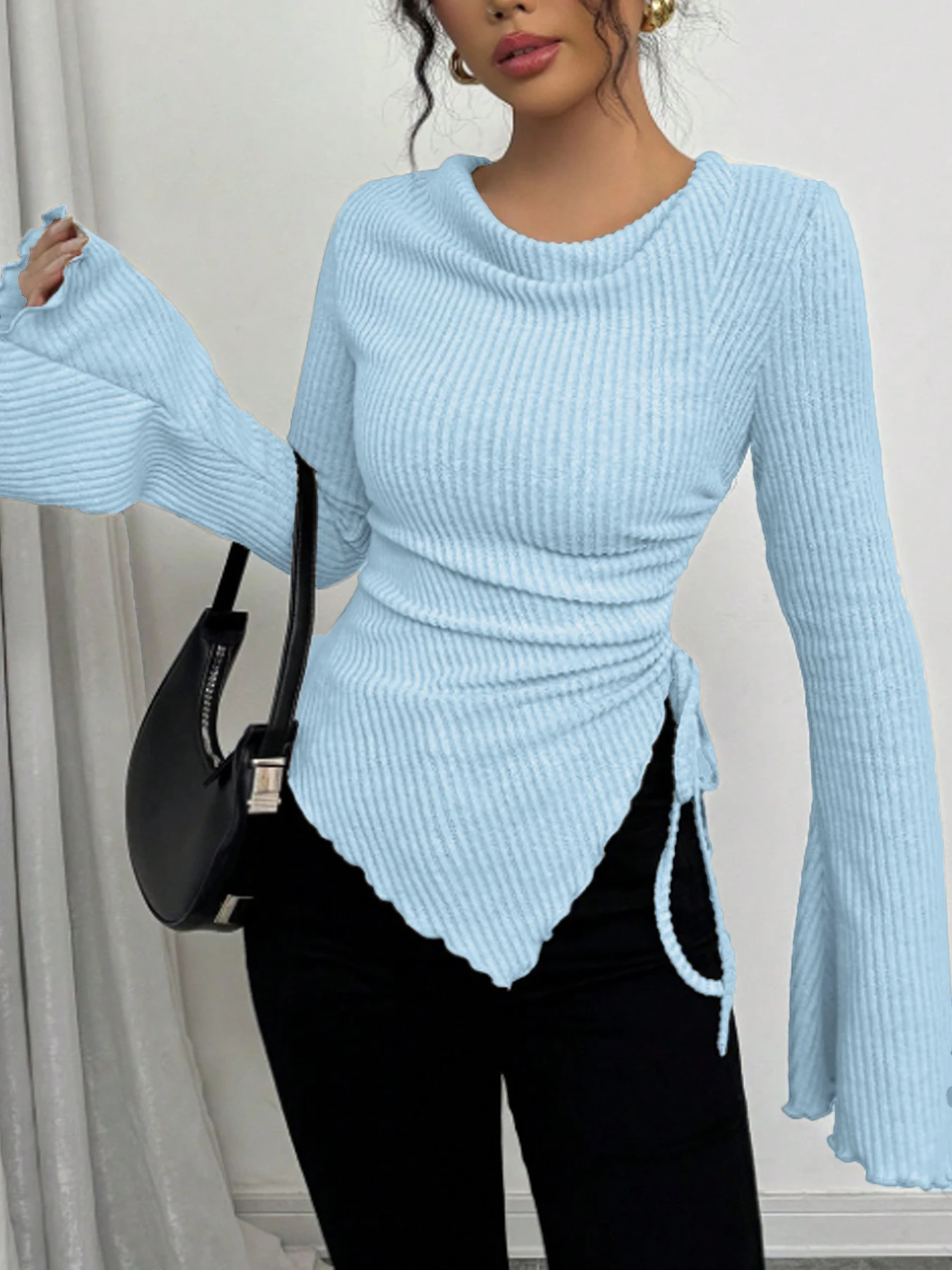 Top a maniche lunghe da donna primavera estate azzurro a costine collo ad anello con coulisse in vita orlo asimmetrico manica a campana chic casual quotidiano