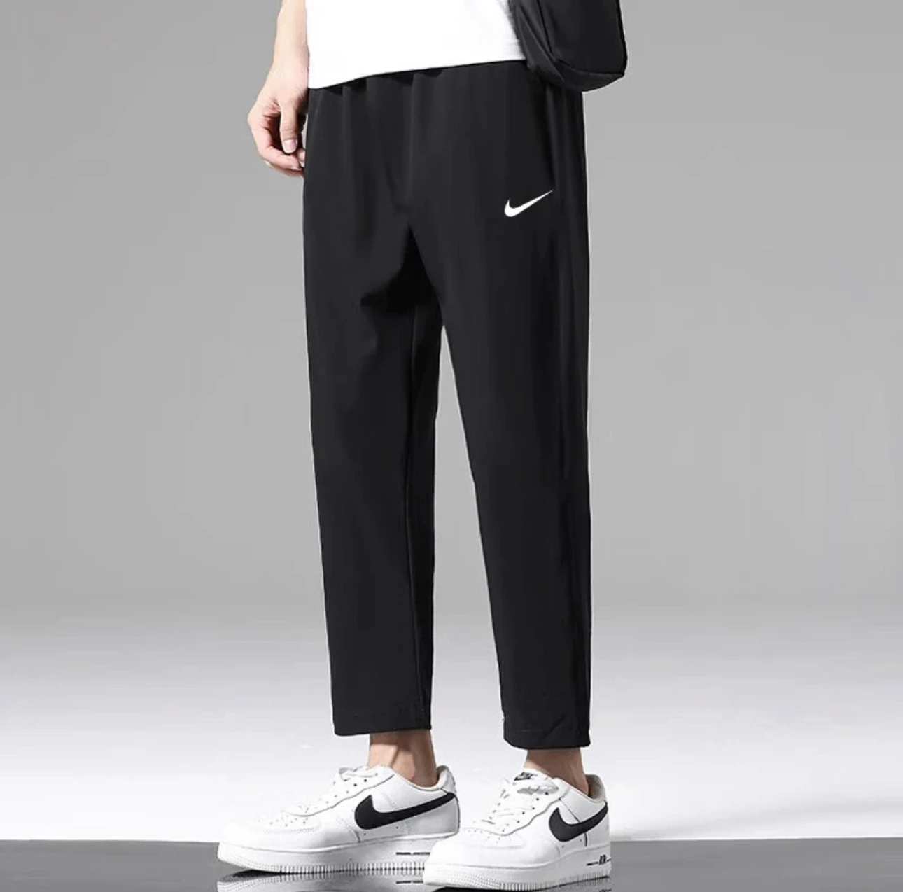 Nike Dri Fit Logo مطبوعة كاجوال فضفاض السرعة الجافة محبوك السراويل الرياضية للرجال أسود FB7491-010