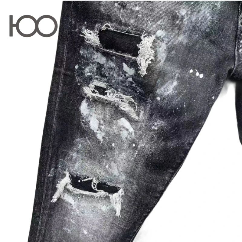 100 C096 Jeans with slim fit, vintage wash, distressed holes with frayed edges, paint splatters – a trendy cool punk style.
