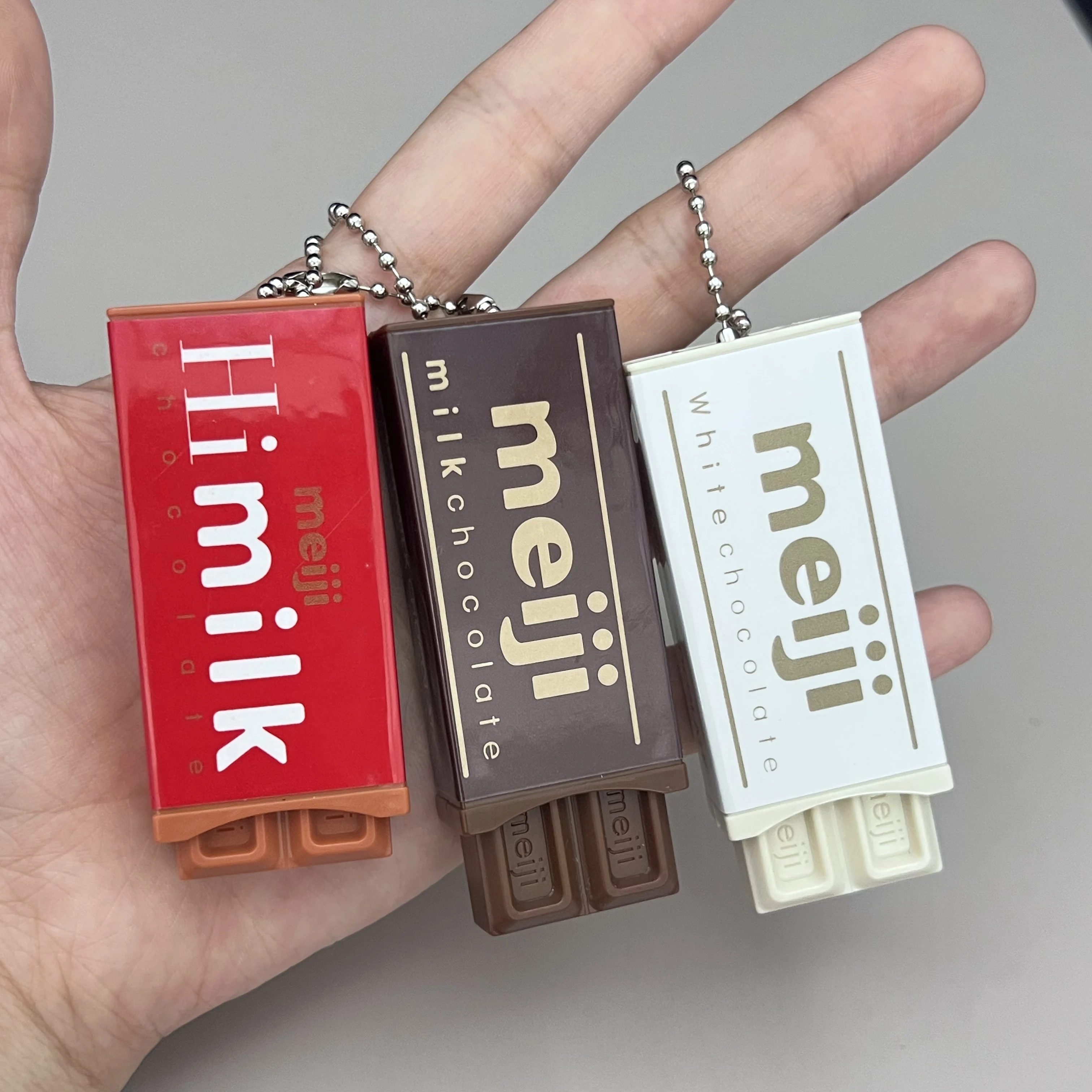 Los juguetes divertidos de comida "Bye-bye" de chocolate Bandai Meiji más vendidos, juguetes para aliviar el estrés, llaveros, mochilas escolares, colgantes y regalo