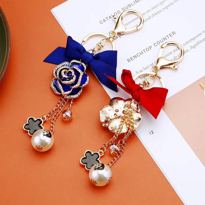 الأزياء القوس عالية Guishan الشاي زهرة سيارة المفاتيح حقيبة قلادة اللؤلؤ هدية صغيرة التبعي