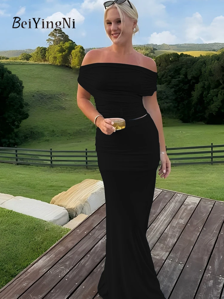 Beiyingni 2025 nueva moda mujer faldas conjuntos de 2 piezas Sexy flaco sin espalda Slash cuello camisetas chándales mujer negro azul conjunto