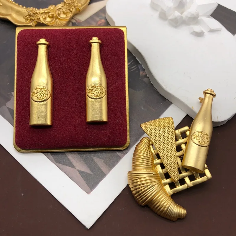 Middle Western gold-plated sailboat wine bottle brooch, silver needle earrings